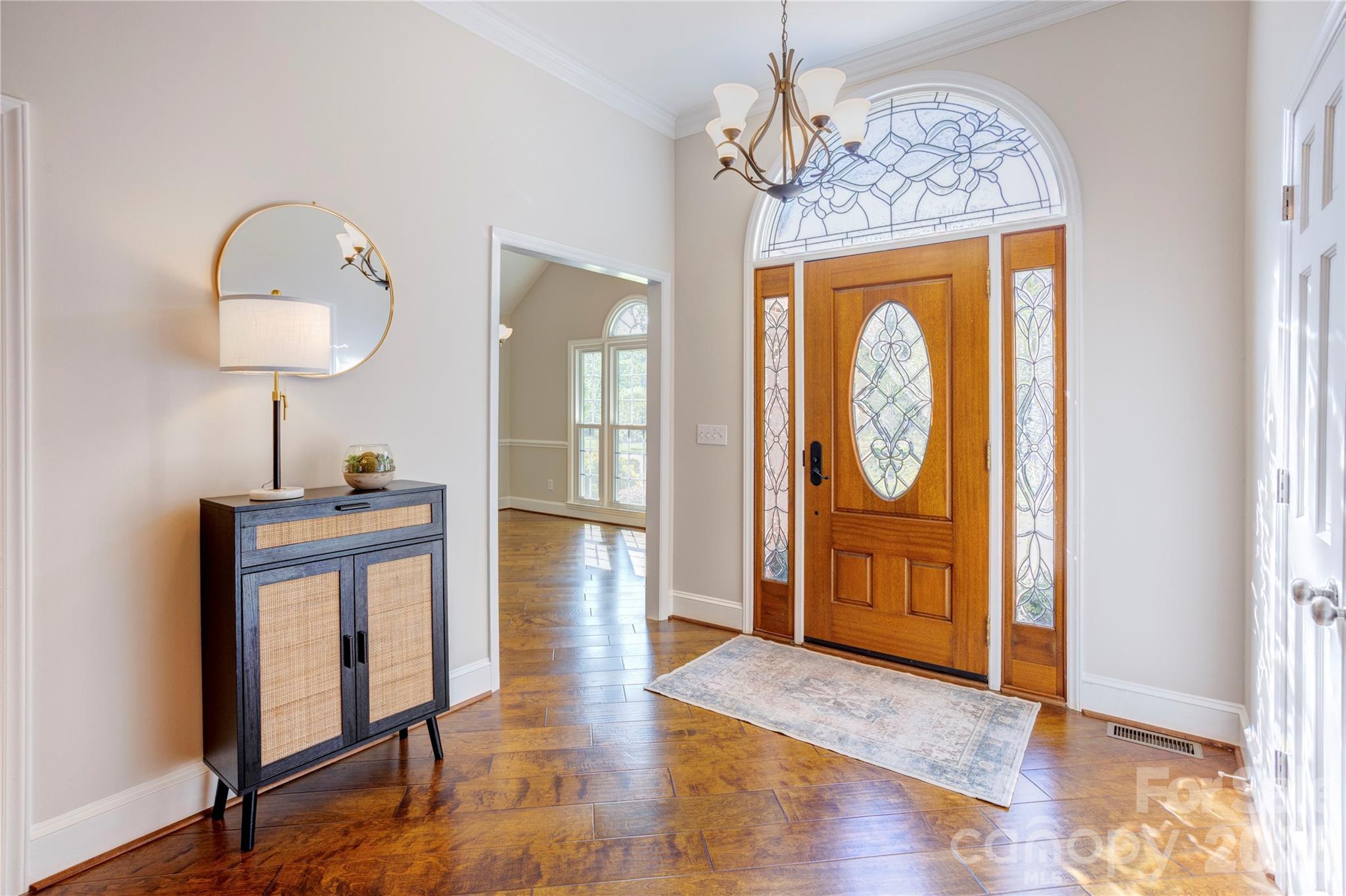 1188 Fawn Ridge Road Northwest Concord, NC 28027 - Photo 7 of 38 a view of hallway with furniture and wooden floor