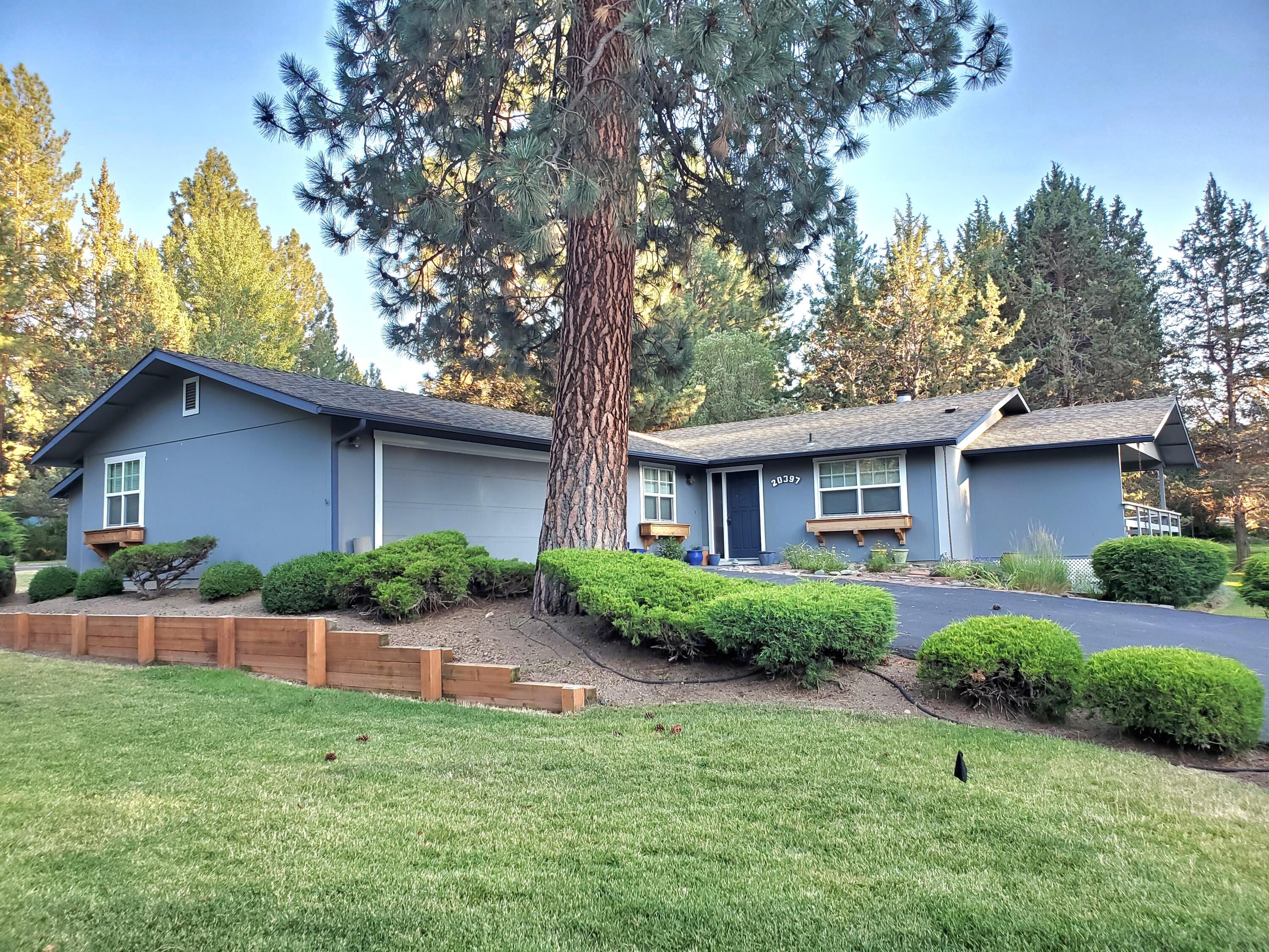 20397 Strawline Road Bend, OR 97702 - Photo 2 of 25 Low maintenance landscaping and the lawns are maintained by the HOA.