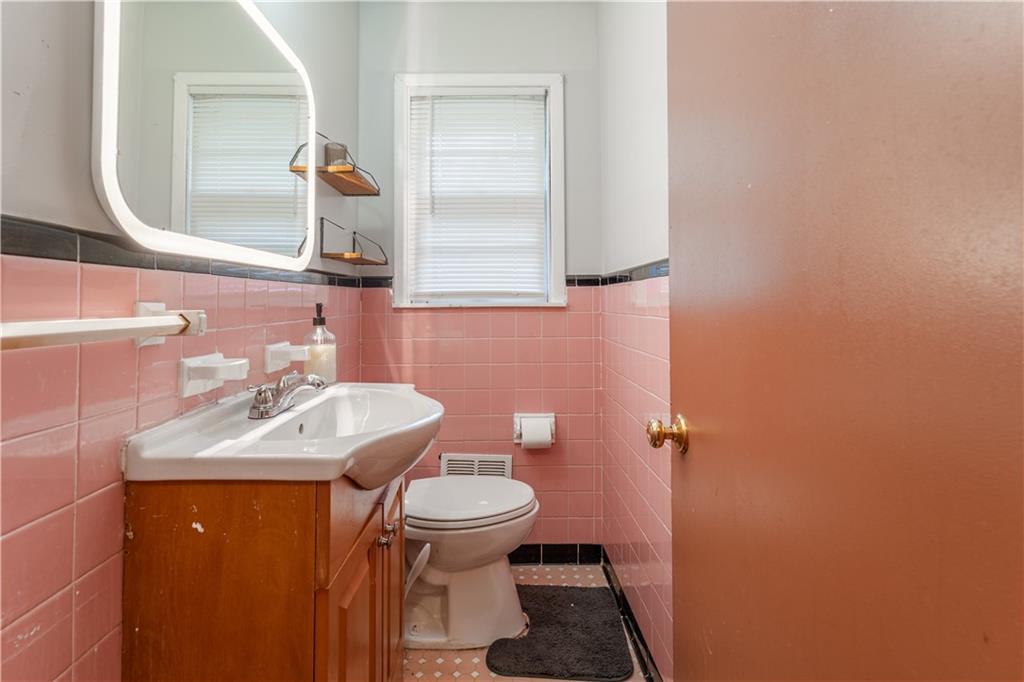 3554 Pine Street Atlanta, GA 30340 - Photo 12 of 21 a bathroom with a sink toilet and mirror