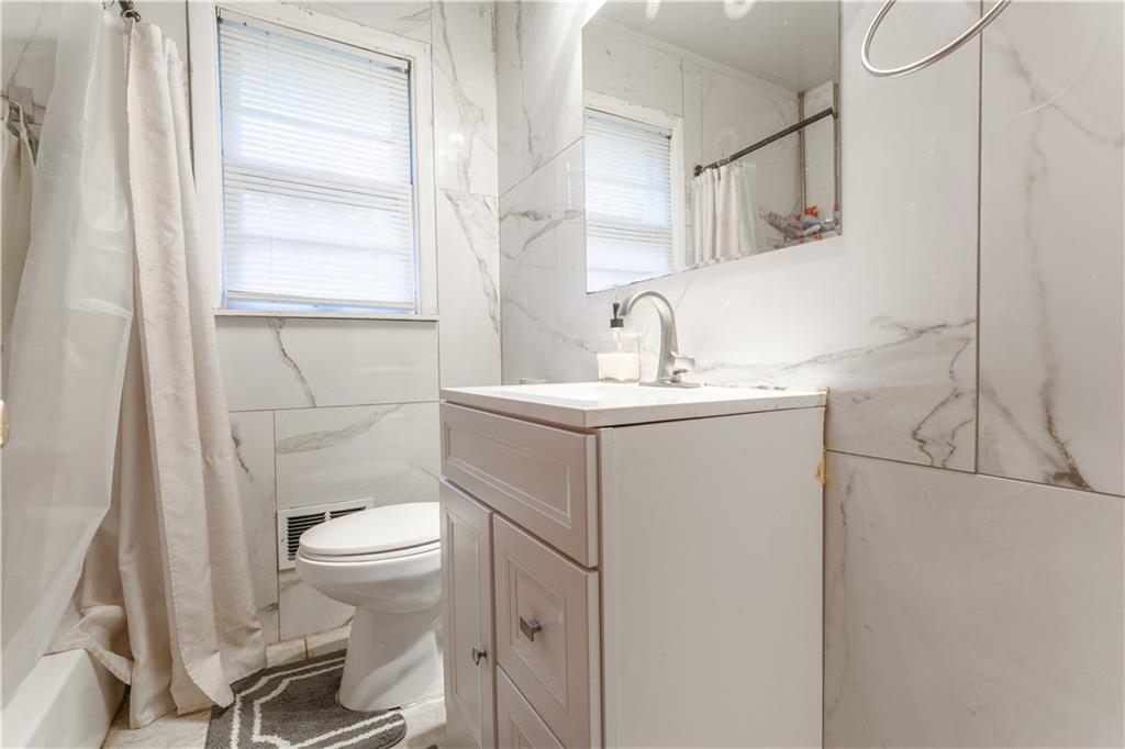 3554 Pine Street Atlanta, GA 30340 - Photo 14 of 21 a bathroom with a sink toilet and mirror