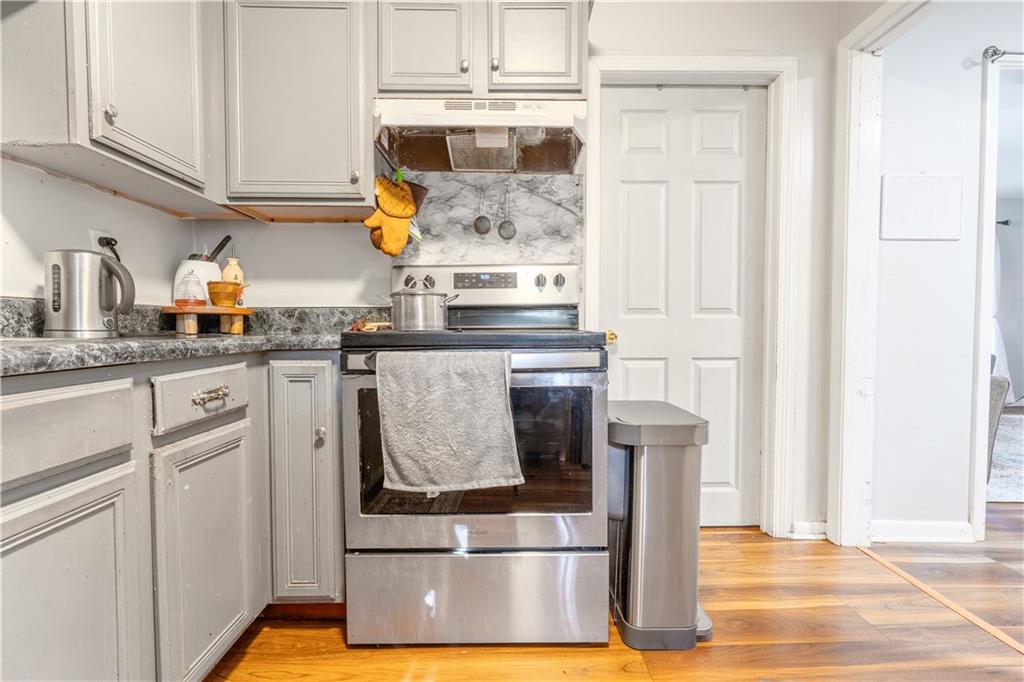 3554 Pine Street Atlanta, GA 30340 - Photo 6 of 21 a kitchen with stainless steel appliances granite countertop a sink and cabinets