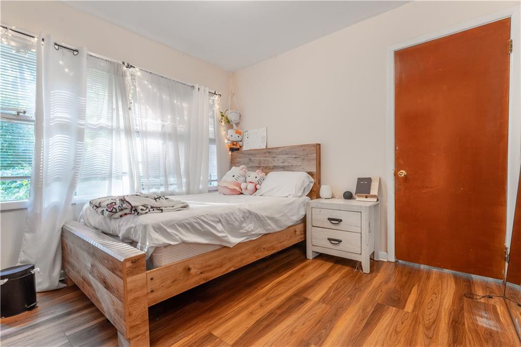 3554 Pine Street Atlanta, GA 30340 - Photo 8 of 21 a bedroom with a bed and a window dresser