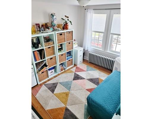 49 Weyham Road Weymouth, MA 02191 - Photo 19 of 36 a living room with furniture and a book shelf