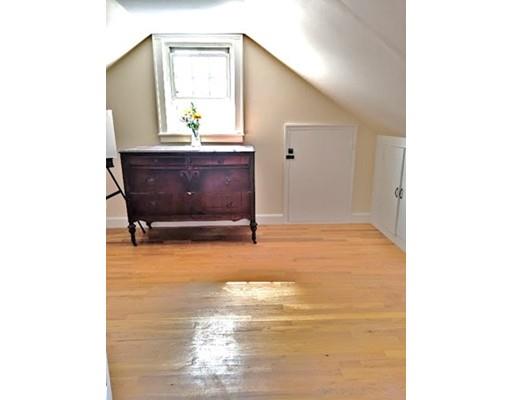 49 Weyham Road Weymouth, MA 02191 - Photo 27 of 36 a living room with a couch and a fireplace