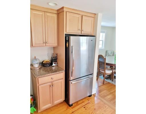 49 Weyham Road Weymouth, MA 02191 - Photo 9 of 36 a kitchen with stainless steel appliances granite countertop a refrigerator and a stove
