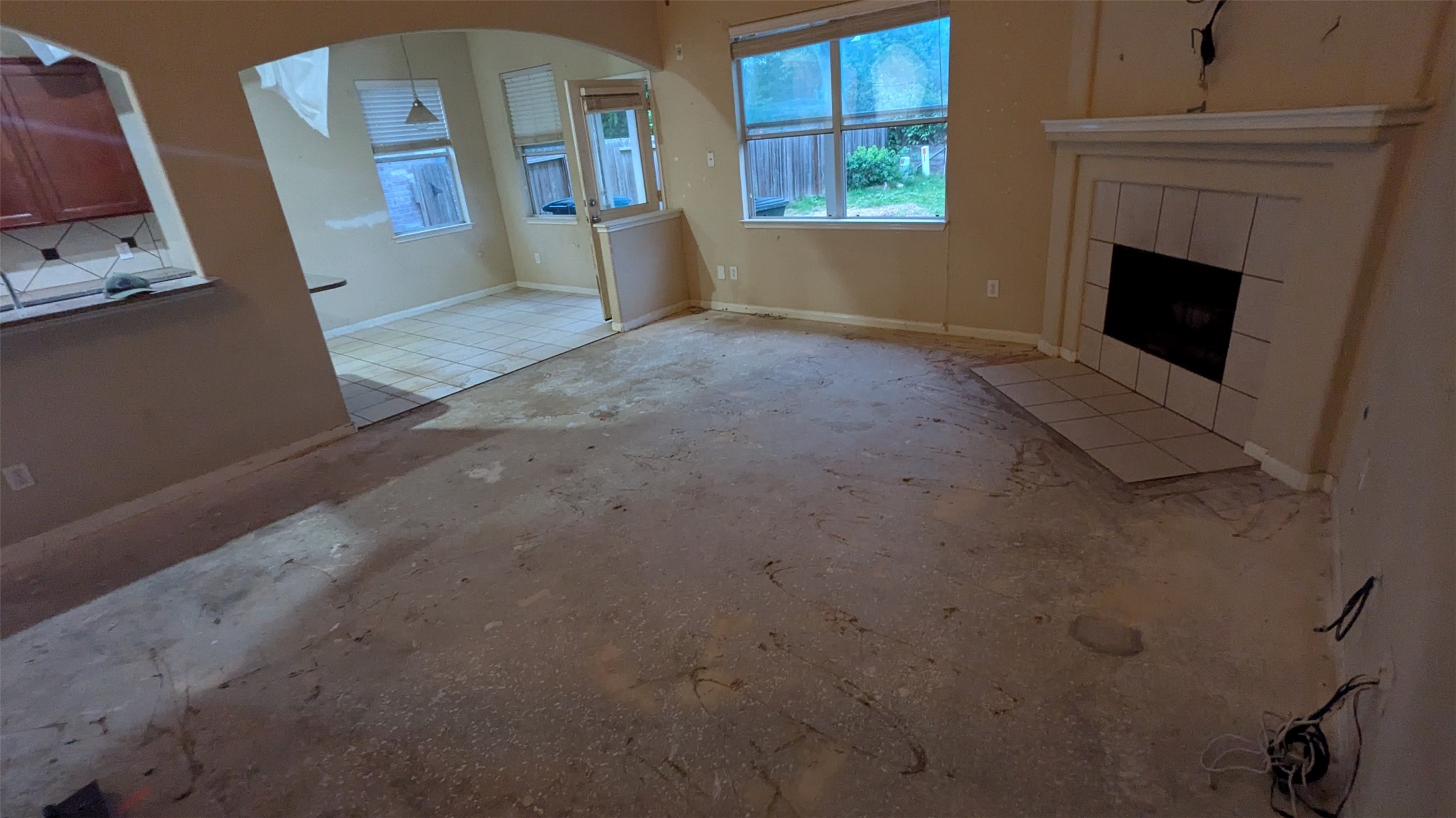 21850 Catoosa Drive Spring, TX 77388 - Photo 6 of 15 a view of an empty room with a fireplace and a window
