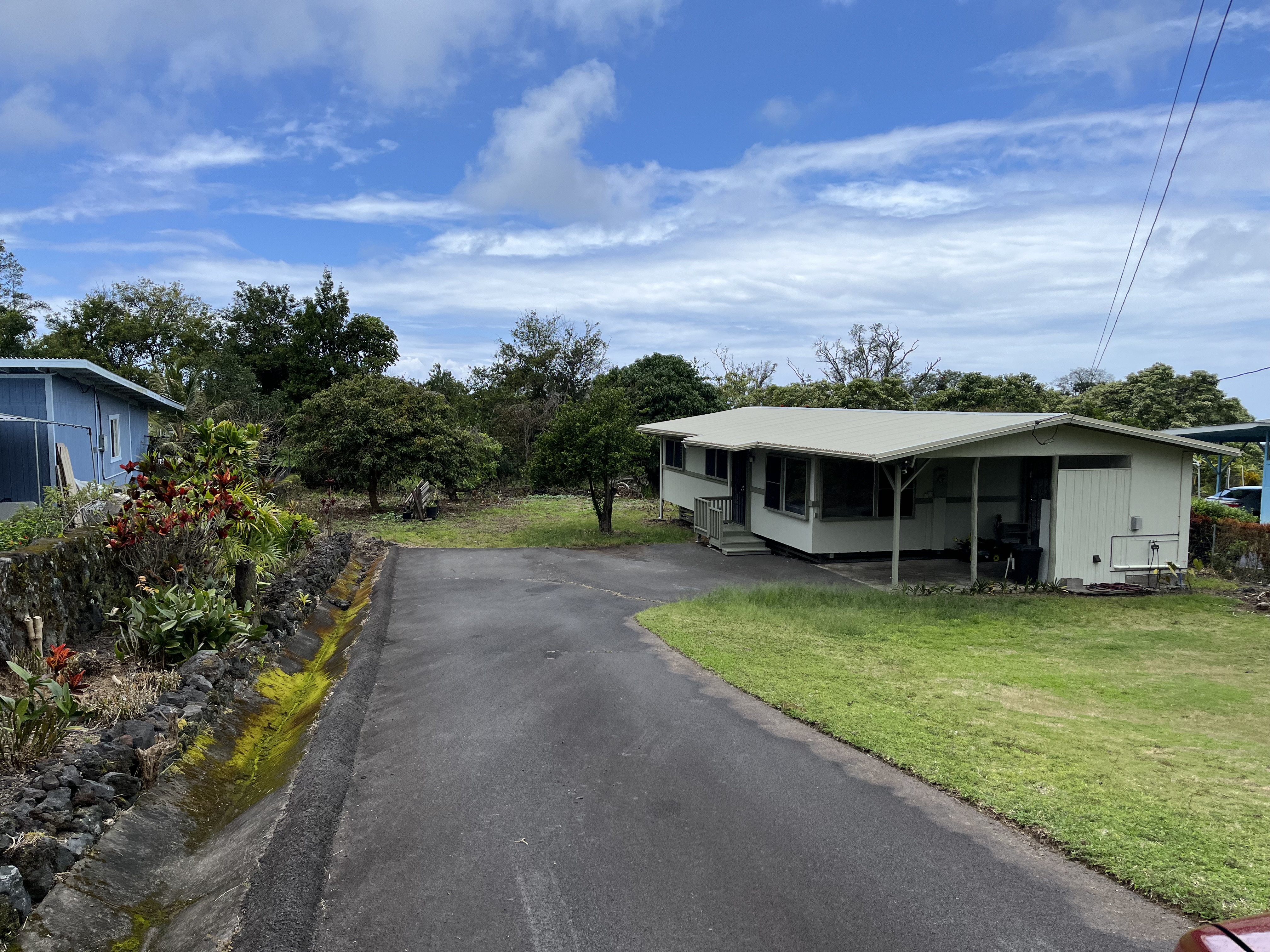 81-6265 Hind Road Captain Cook, HI 96704 - Photo 1 of 5 a view of a house with a yard balcony and sitting area
