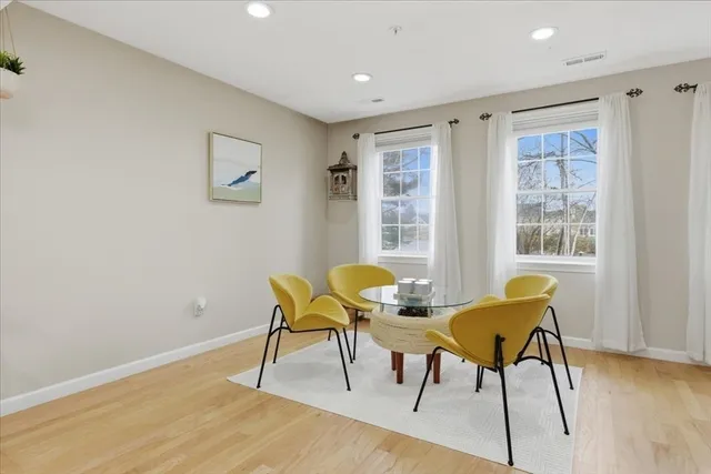 a workspace room with furniture and wooden floor