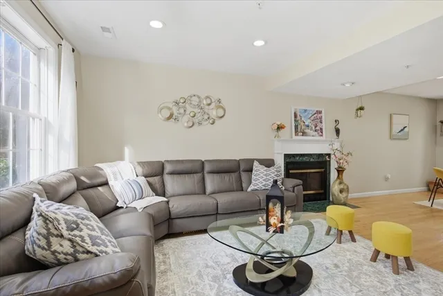 a living room with furniture and a fireplace