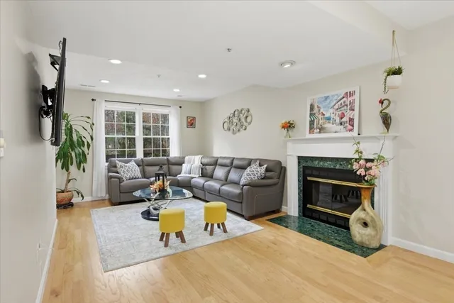 a living room with furniture and a fireplace