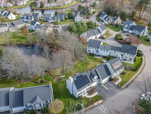 an aerial view of a house with outdoor space