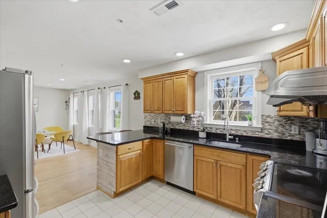 a kitchen with a sink stove and cabinets