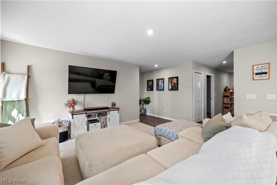 2161 Fowl Road Elyria, OH 44035 - Photo 14 of 46 Open-concept living space featuring recessed lighting, light neutral wall tones, and wood-finish flooring
