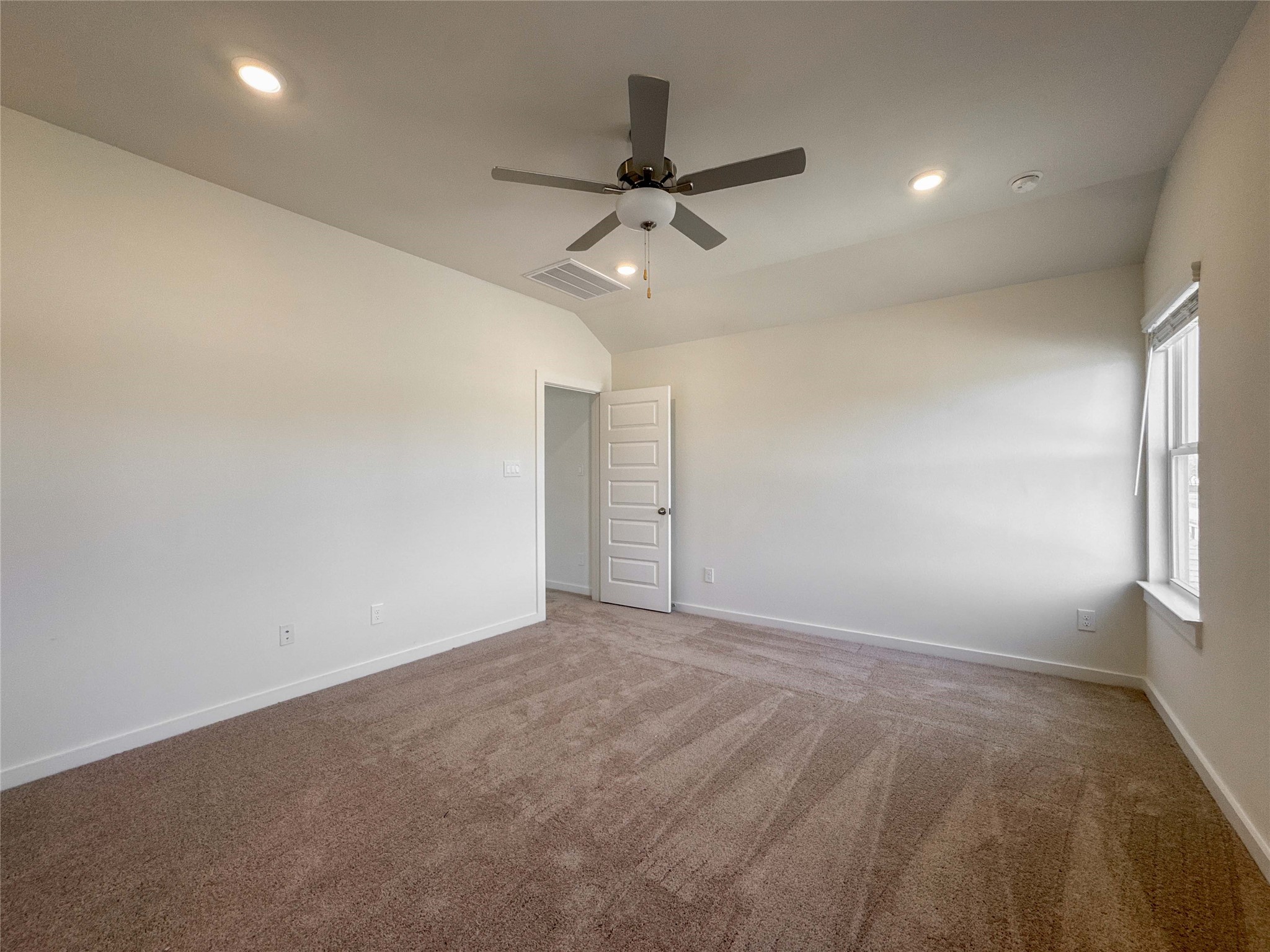 1115 Santee Court Rosharon, TX 77583 - Photo 14 of 24 en empty room with ceiling fan and window