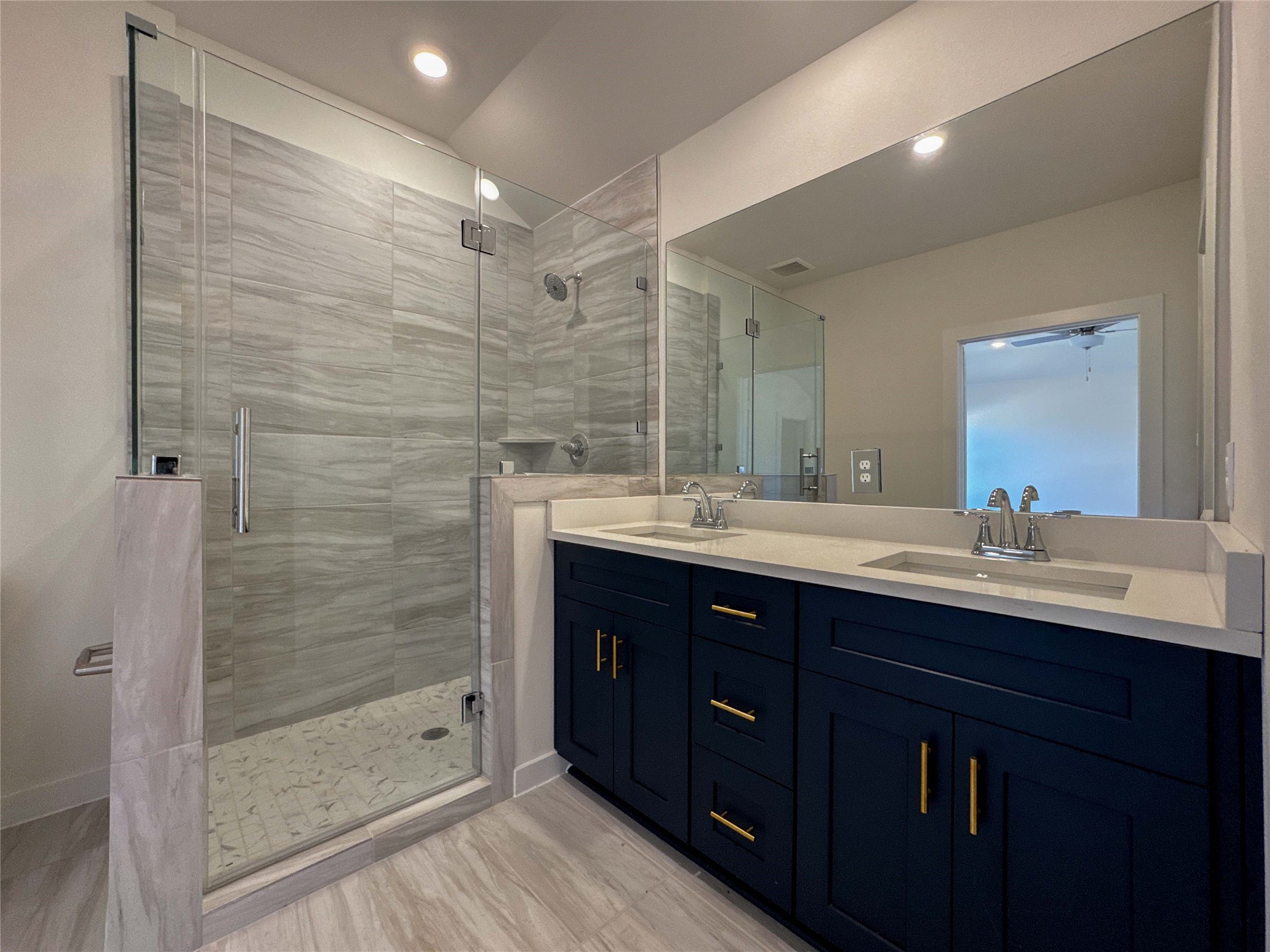 1115 Santee Court Rosharon, TX 77583 - Photo 16 of 24 a bathroom with a double vanity sink mirror and shower