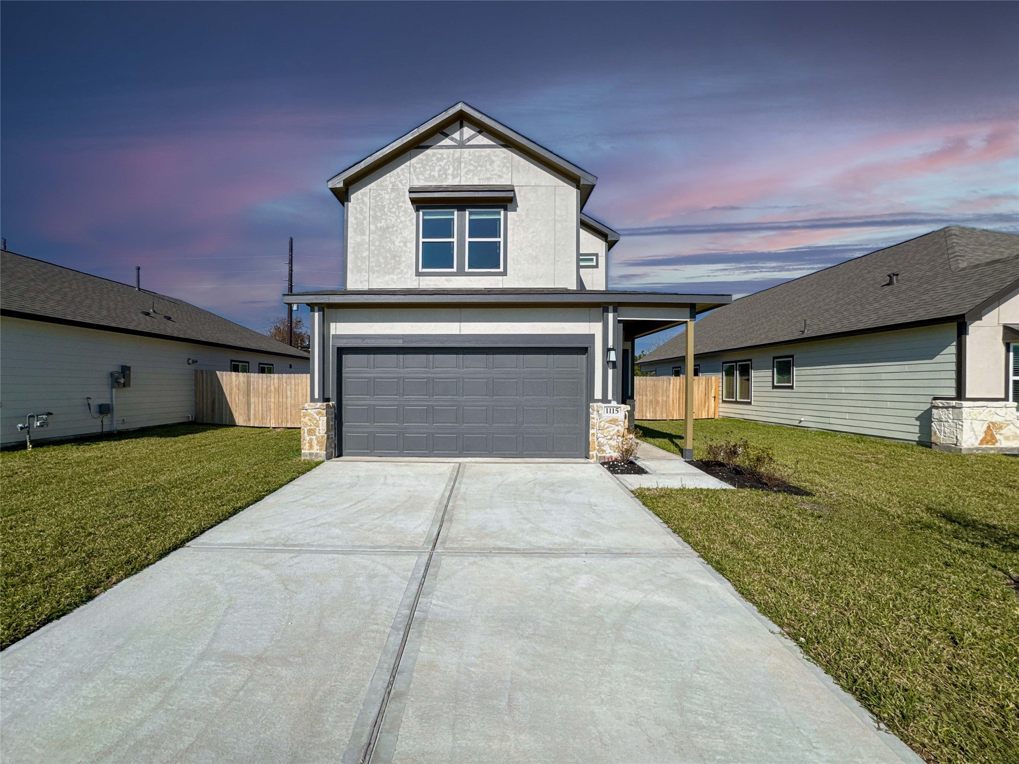 1115 Santee Court Rosharon, TX 77583 - Photo 2 of 24 a front view of a house with a yard and garage