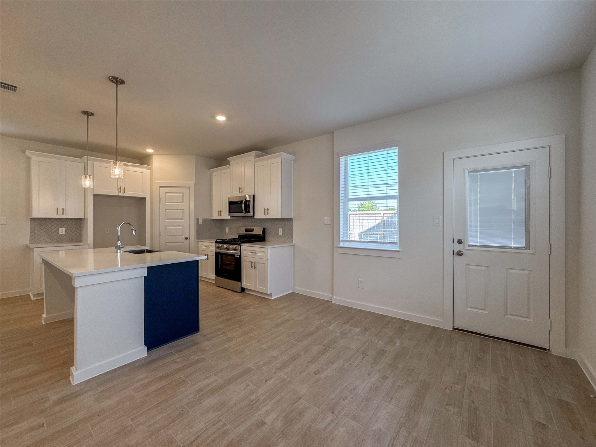 1115 Santee Court Rosharon, TX 77583 - Photo 10 of 24 a kitchen with stainless steel appliances granite countertop a refrigerator a sink dishwasher a stove and oven with wooden floor
