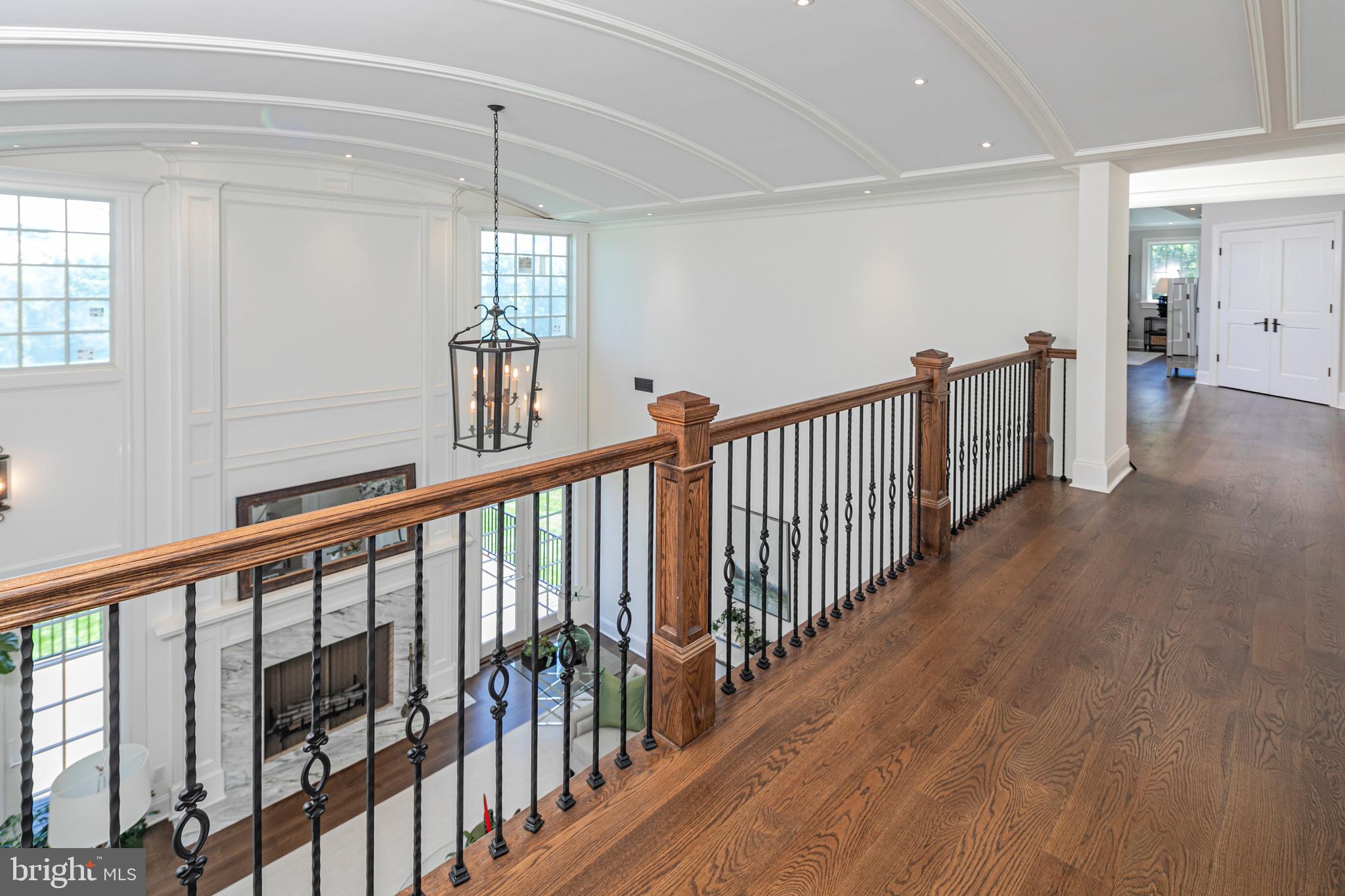 280 Carter Road Princeton, NJ 08540 - Photo 30 of 79 a view of a hallway with wooden floor and windows