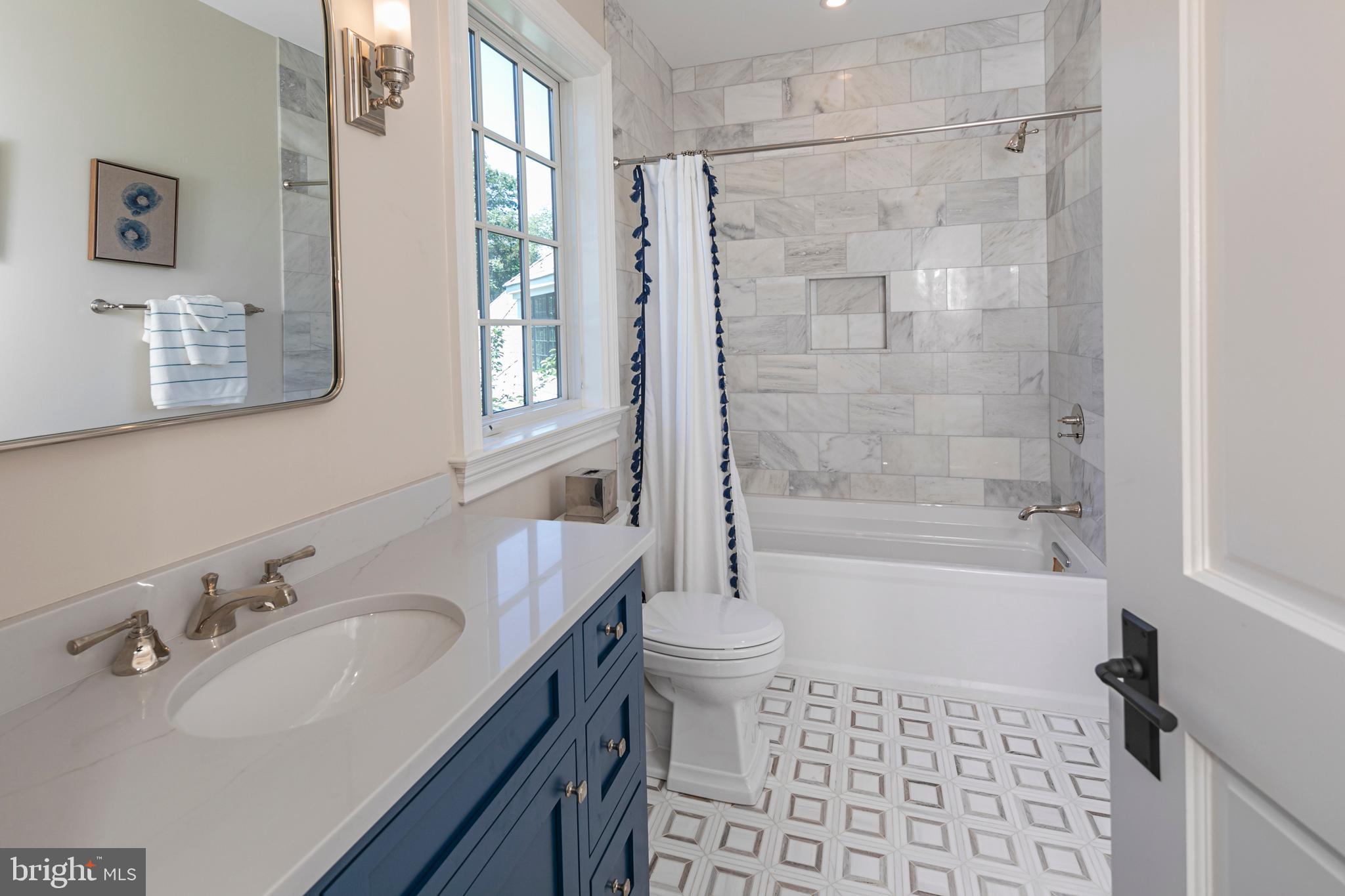 280 Carter Road Princeton, NJ 08540 - Photo 38 of 79 a bathroom with a sink a toilet a mirror a bathtub and shower