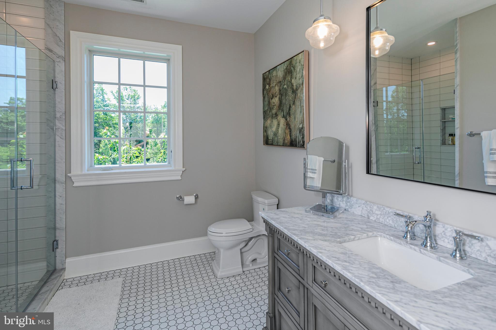 280 Carter Road Princeton, NJ 08540 - Photo 42 of 79 a bathroom with a granite countertop double vanity sink a mirror and a toilet