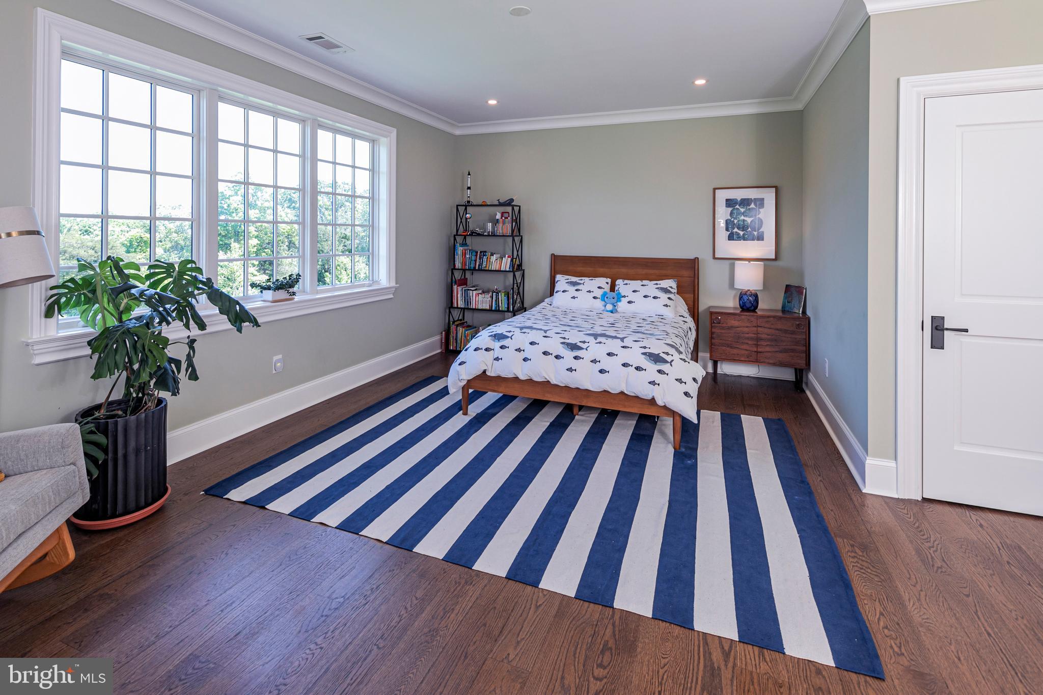 280 Carter Road Princeton, NJ 08540 - Photo 43 of 79 a bedroom with a bed and a wooden floor