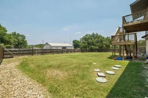 a view of a swimming pool with a yard