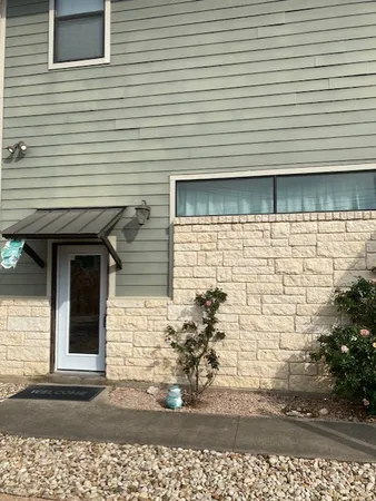 a front view of a house with parking