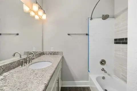 an empty room with closet and ceiling fan