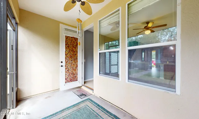a kitchen with granite countertop a stove sink and refrigerator