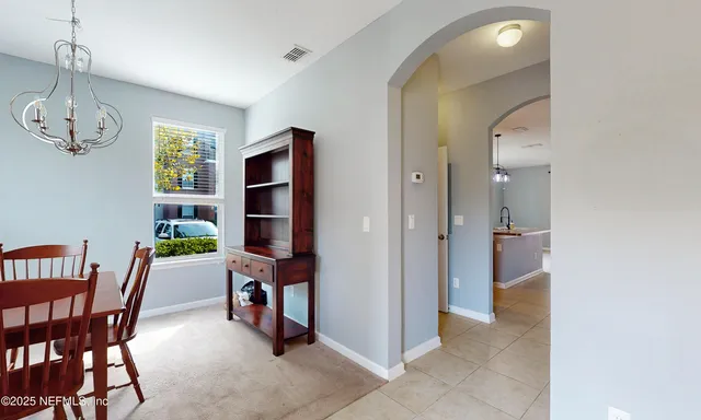 en empty room with a ceiling fan and window