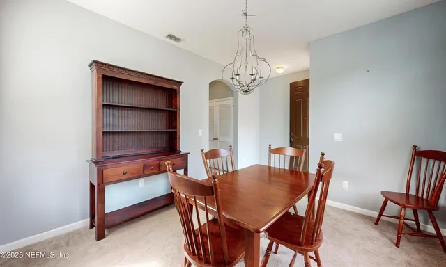 an aerial view of residential house with outdoor space and swimming pool