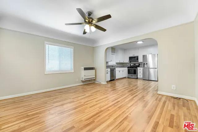 a view of a kitchen with a stove cabinets and wooden floor