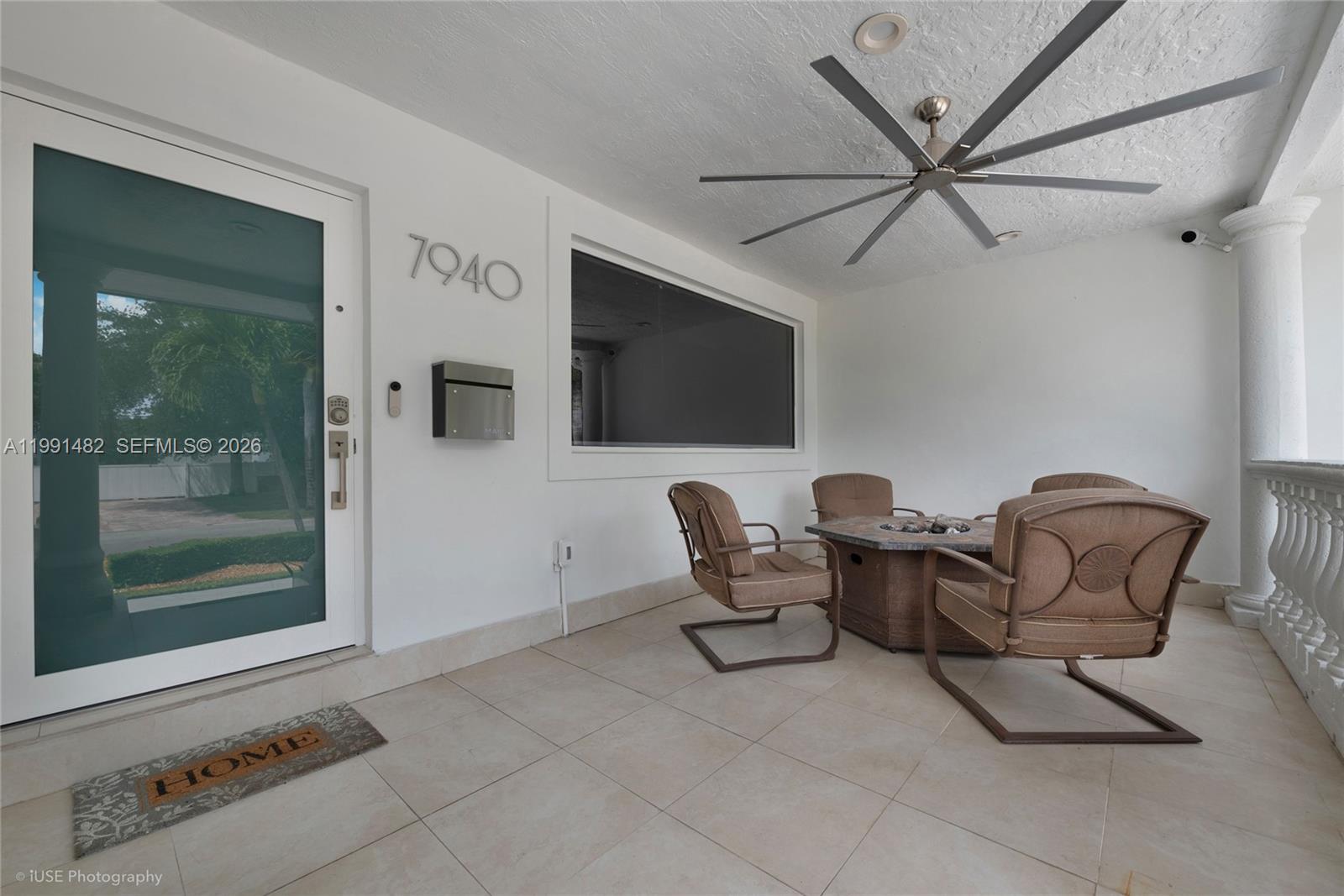 7940 Southwest 20th Street Miami, FL 33155 - Photo 11 of 29 a living room with furniture and a flat screen tv