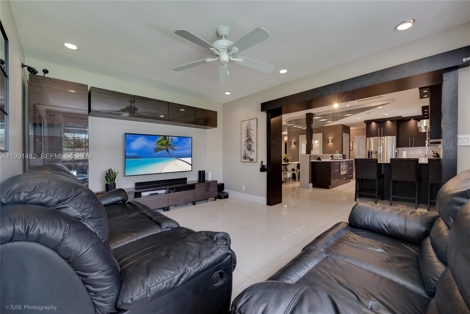 7940 Southwest 20th Street Miami, FL 33155 - Photo 4 of 29 a living room with furniture and a flat screen tv