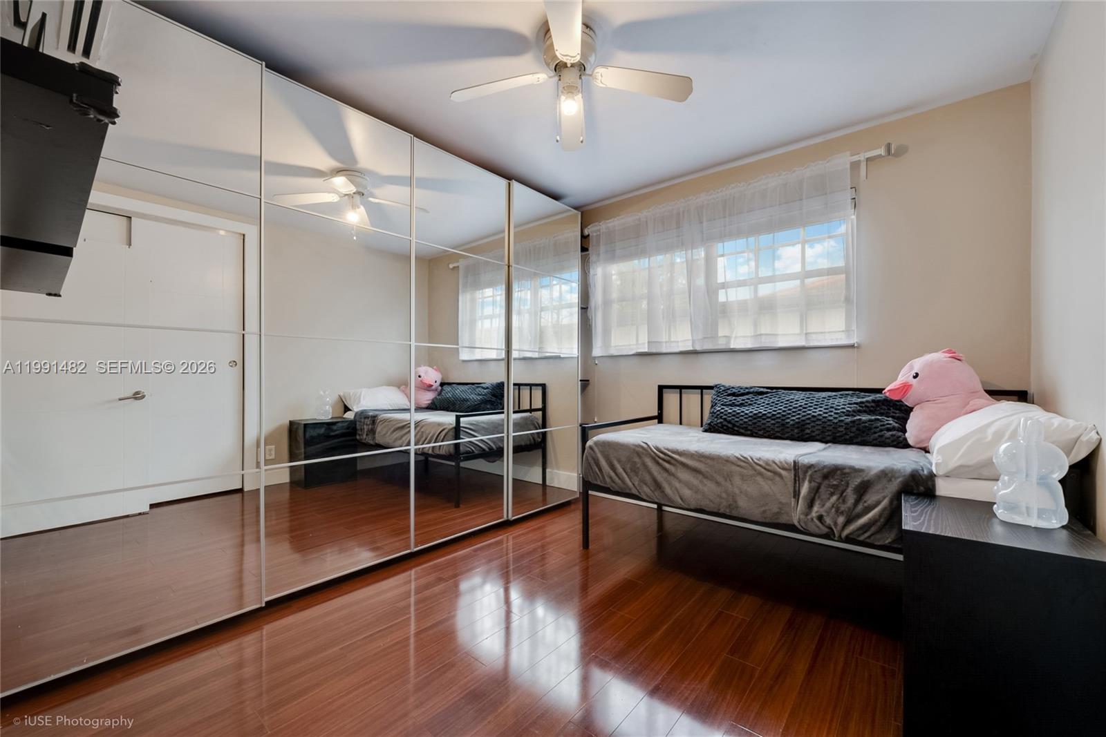 7940 Southwest 20th Street Miami, FL 33155 - Photo 8 of 29 a living room with furniture a flat screen tv and kitchen view