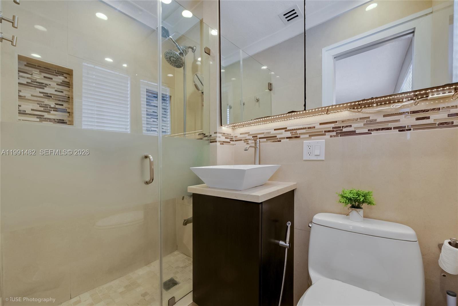 7940 Southwest 20th Street Miami, FL 33155 - Photo 10 of 29 a bathroom with a sink a toilet and shower