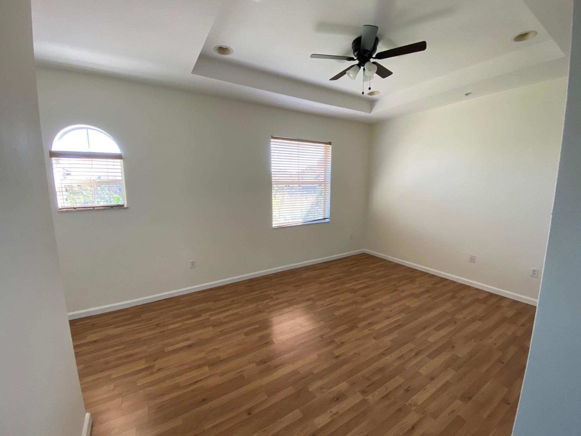 1272 Via Fiume Boynton Beach, FL 33426 - Photo 11 of 51 an empty room with windows and fan