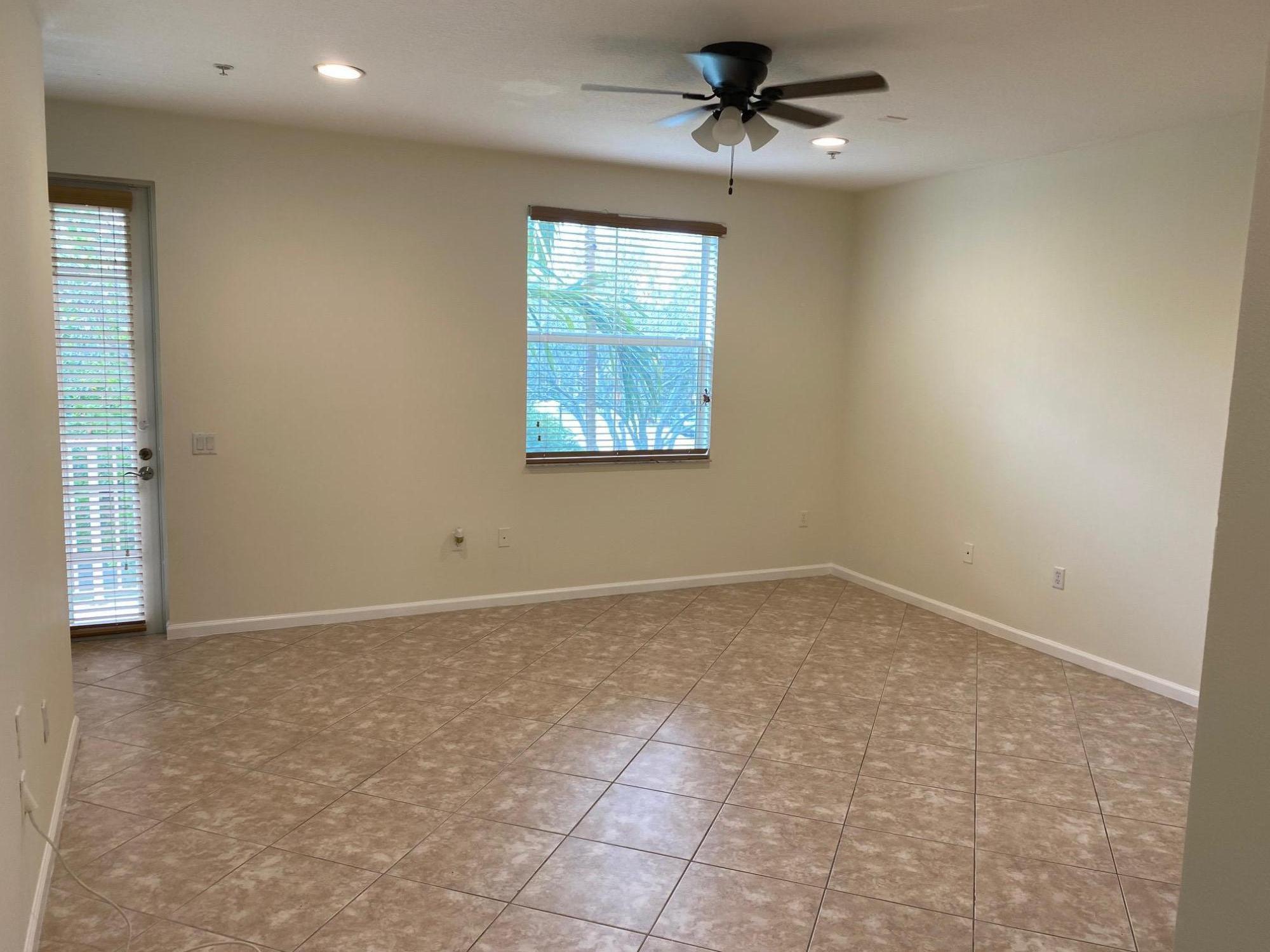 1272 Via Fiume Boynton Beach, FL 33426 - Photo 30 of 51 an empty room with windows and fan