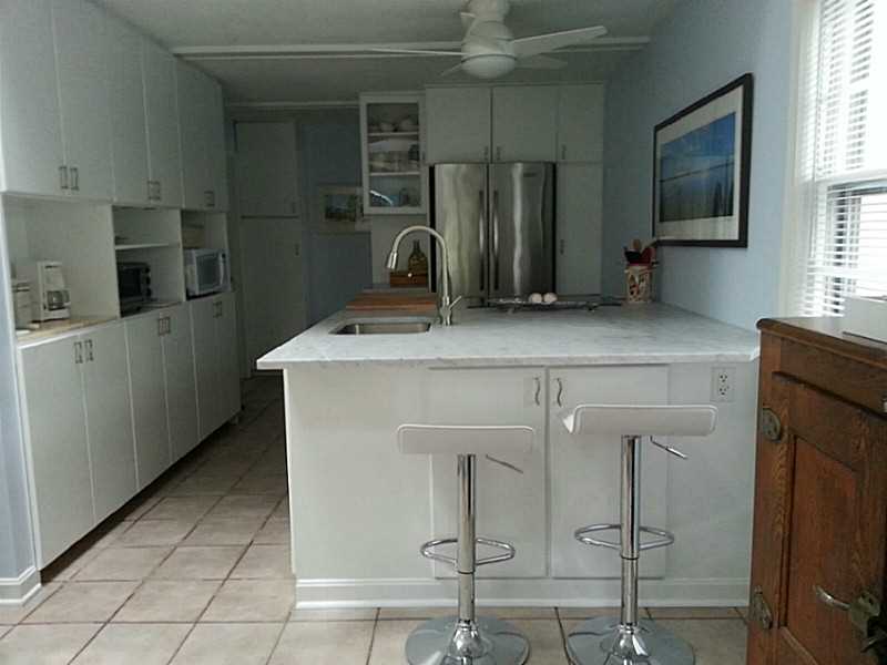 4 Standish Road Jamestown, RI 02835 - Photo 7 of 13 Kitchen. Kitchen with Carrera Marble Island and New SS Appliances. Island Seating too.