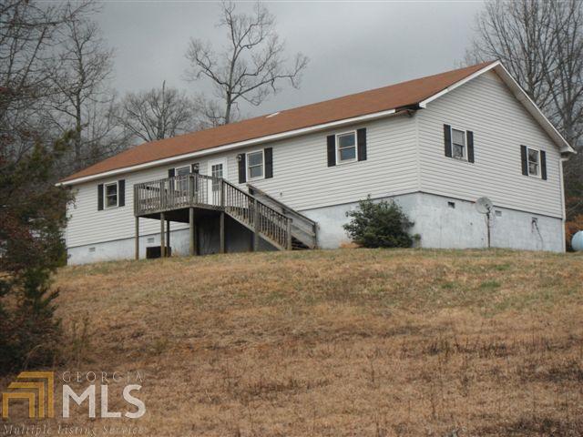76 Mt Pleasant Church Road Cleveland, GA 30528 - Photo 1 of 1 a house that has a tree in front of it