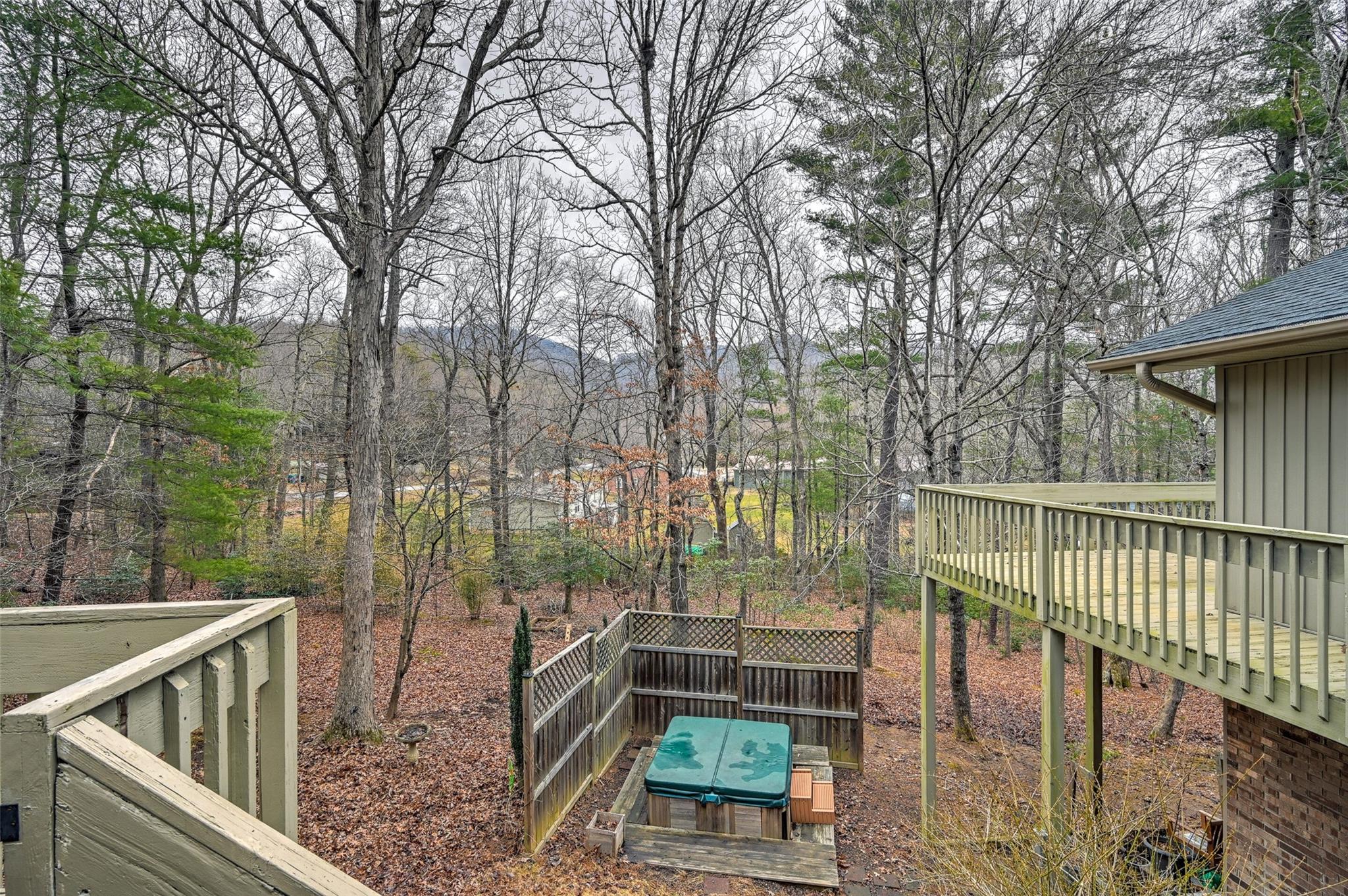 209 Riva Ridge Drive Fairview, NC 28730 - Photo 16 of 23 a view of a balcony with chairs and wooden fence