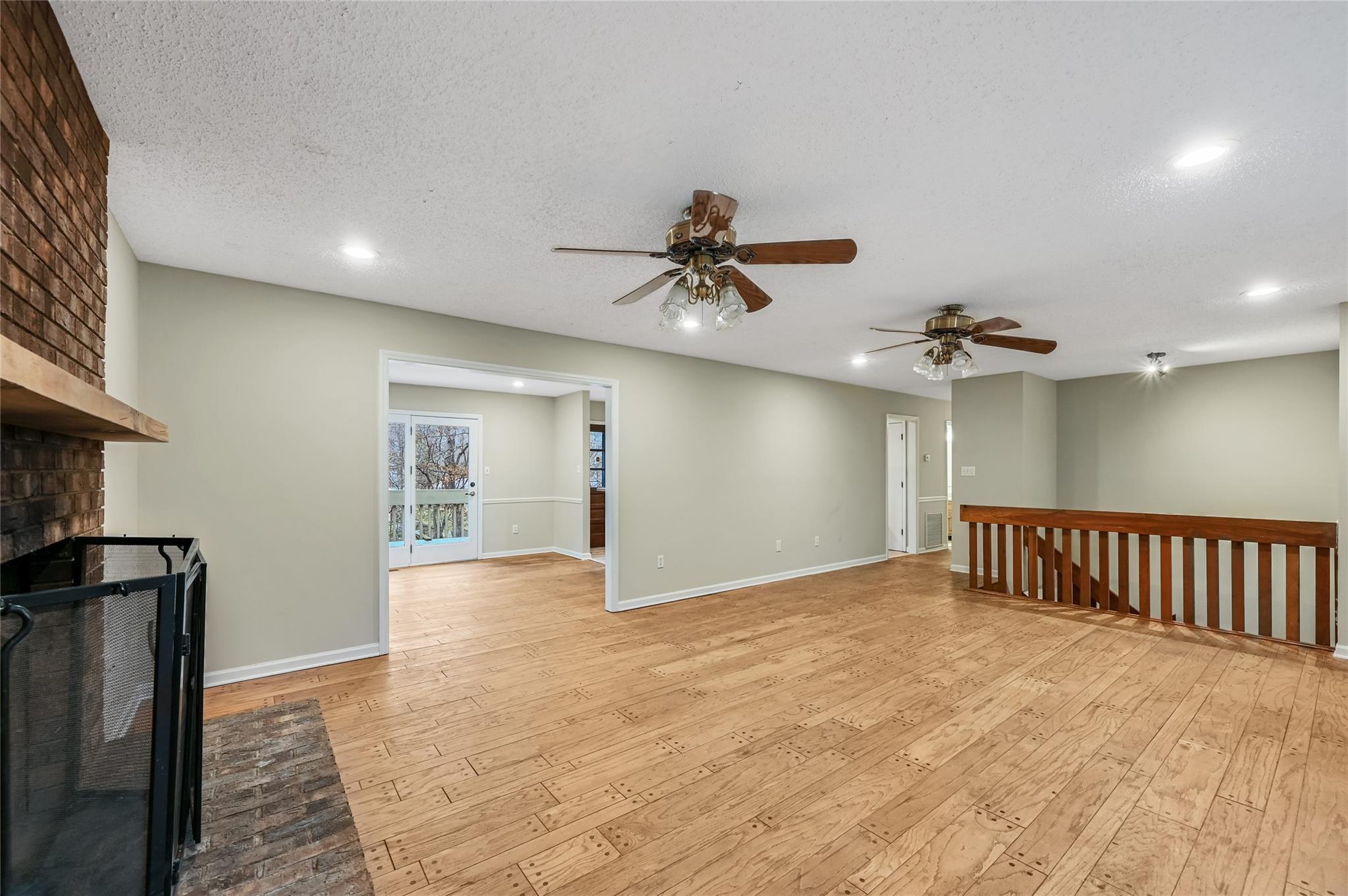 209 Riva Ridge Drive Fairview, NC 28730 - Photo 3 of 23 a view of an empty room with a ceiling fan