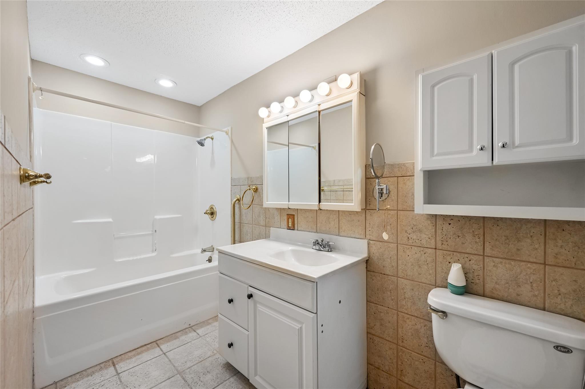 209 Riva Ridge Drive Fairview, NC 28730 - Photo 10 of 23 a bathroom with a sink a toilet and bathtub