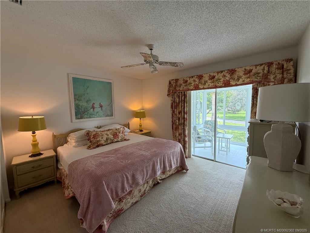 2929 Southeast Ocean Boulevard, Unit 8 Stuart, FL 34996 - Photo 15 of 22 a bedroom with a bed and window
