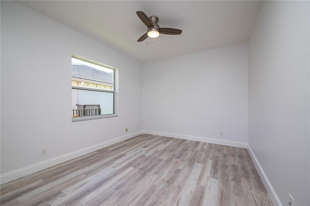 3759 Oak Ridge Circle Weston, FL 33331 - Photo 25 of 31 an empty room with a window and a ceiling fan