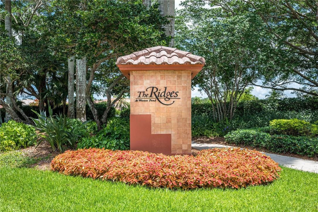3759 Oak Ridge Circle Weston, FL 33331 - Photo 28 of 31 a sign board with a house and yard at the back