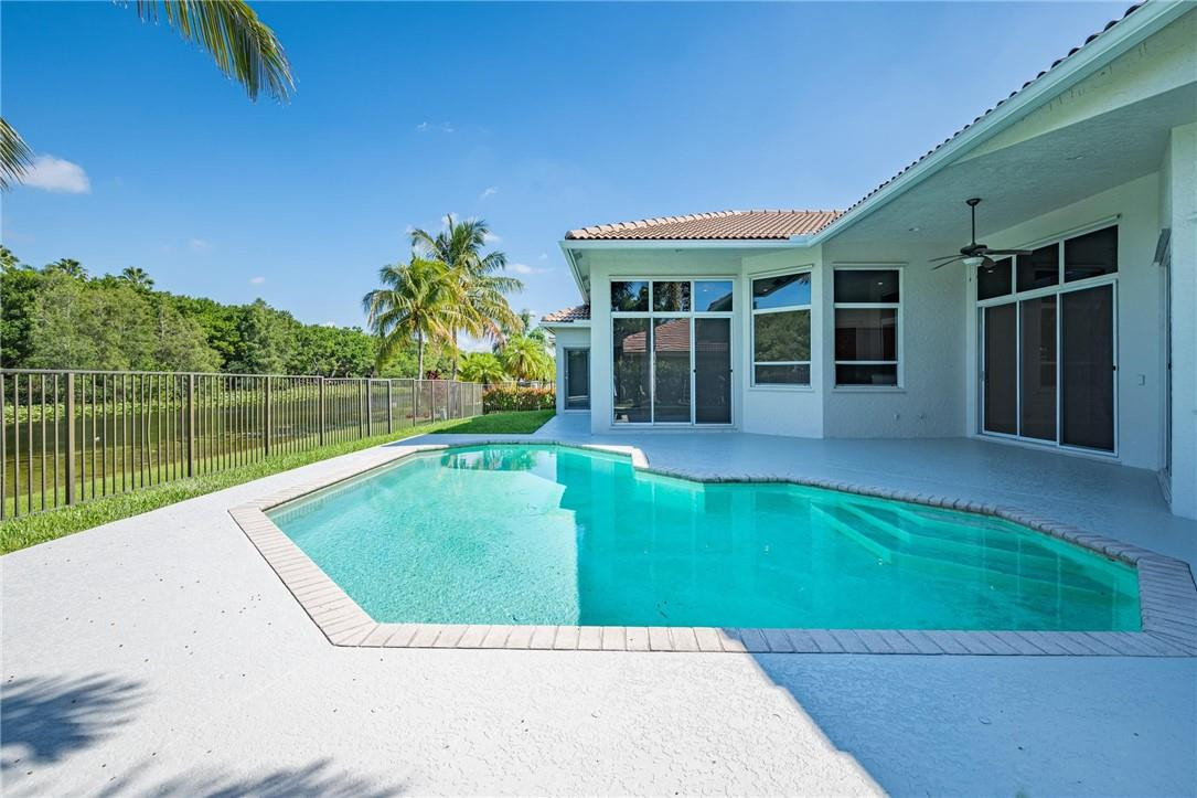 3759 Oak Ridge Circle Weston, FL 33331 - Photo 3 of 31 a view of a house with a swimming pool