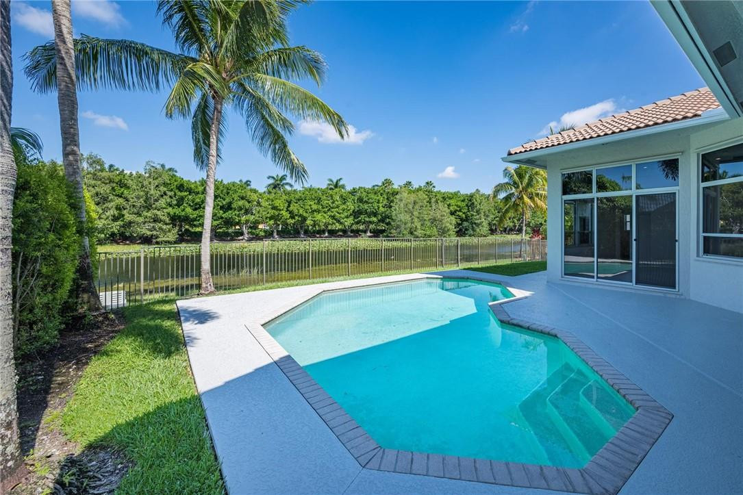 3759 Oak Ridge Circle Weston, FL 33331 - Photo 7 of 31 a view of a backyard with swimming pool