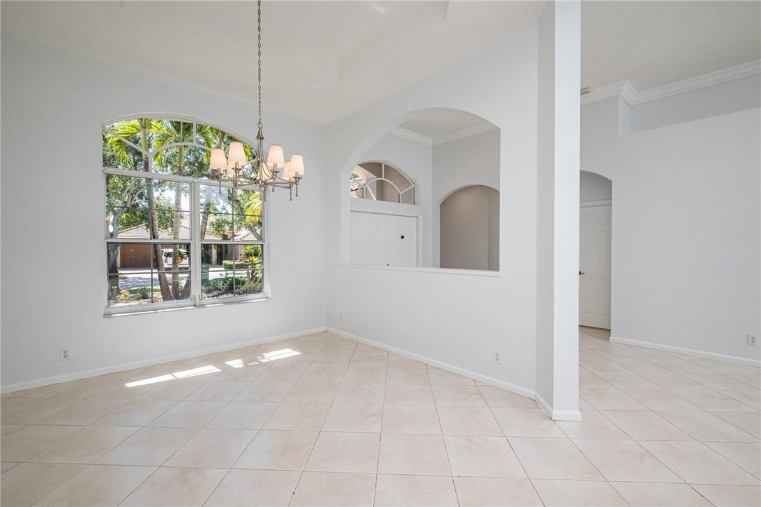 3759 Oak Ridge Circle Weston, FL 33331 - Photo 10 of 31 a view of a room that has a lot of windows