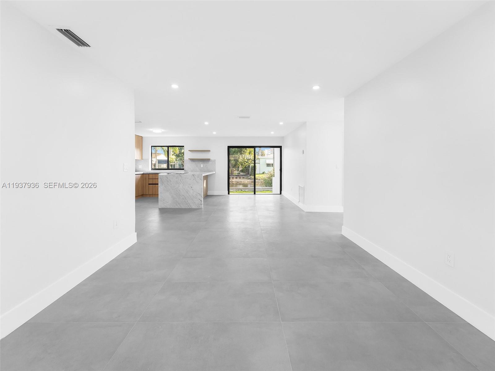 212 Southwest 7th Street Hallandale Beach, FL 33009 - Photo 6 of 23 a view of an empty room with a window